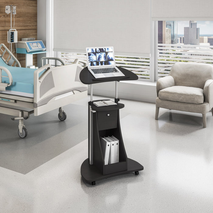 Techni Mobili RTA-B005 tilting desktop laptop cart in black from diagonal back view in hospital room lifestyle image